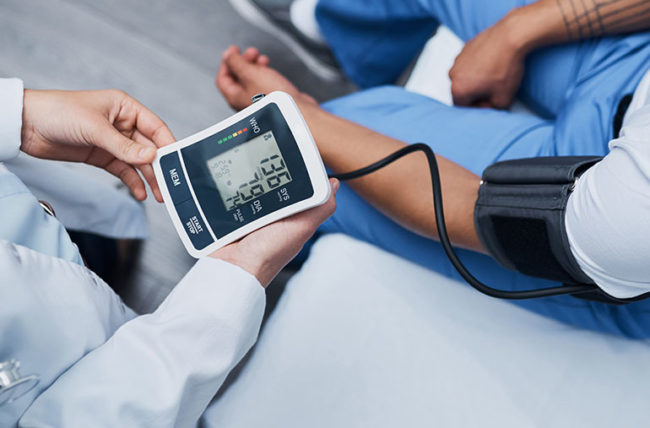doctor measuring blood pressure